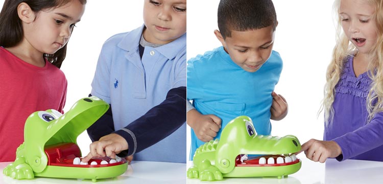 bambini che giocano con il gioco da tavolo Cocco Dentista